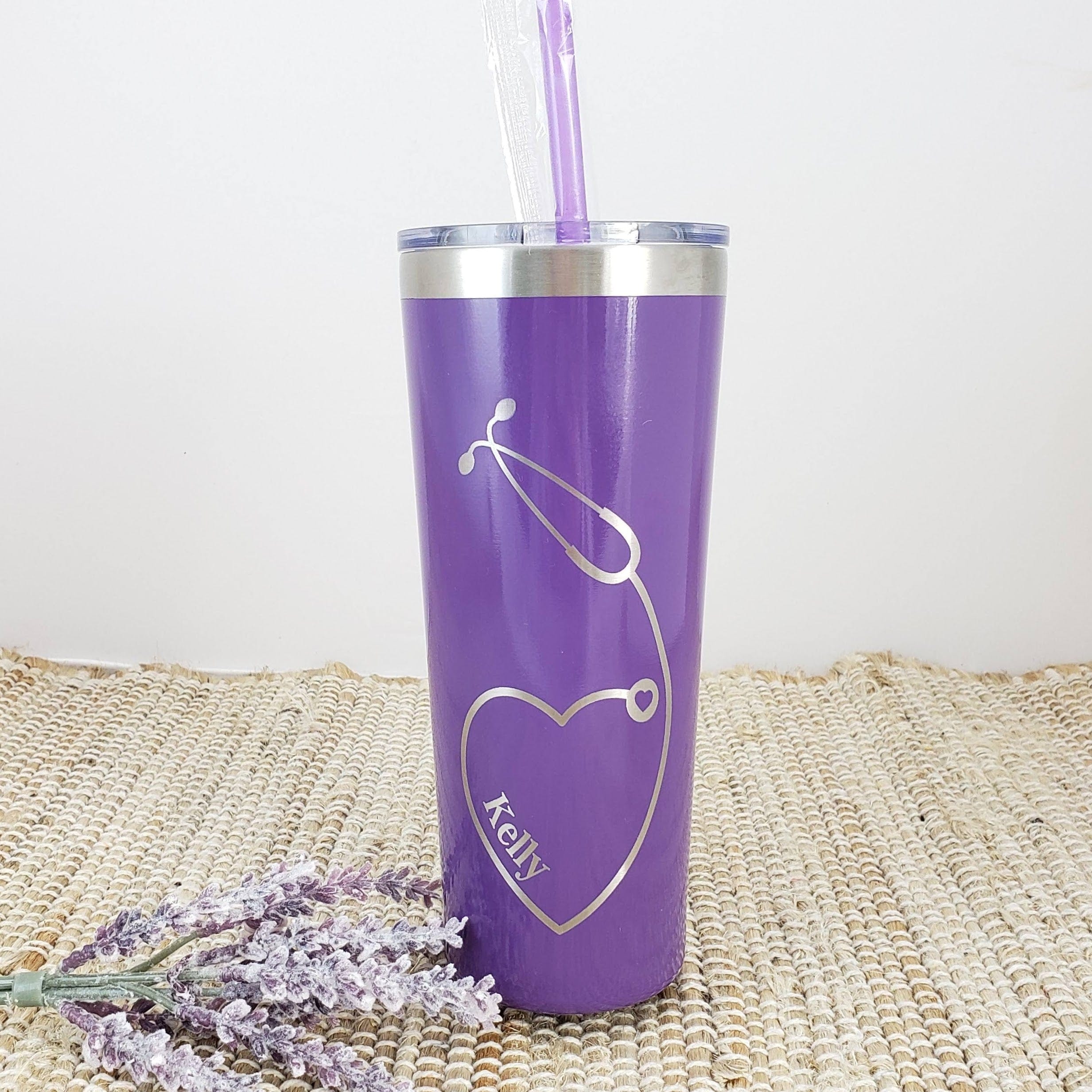 https://candywrapperstore.com/cdn/shop/files/nurse-heart-stethoscope-engraved-tumbler-with-name-on-front-double-wall-insulated-tumbler-with-clear-slider-lid-colored-straw-35758606319774.jpg?v=1691049734