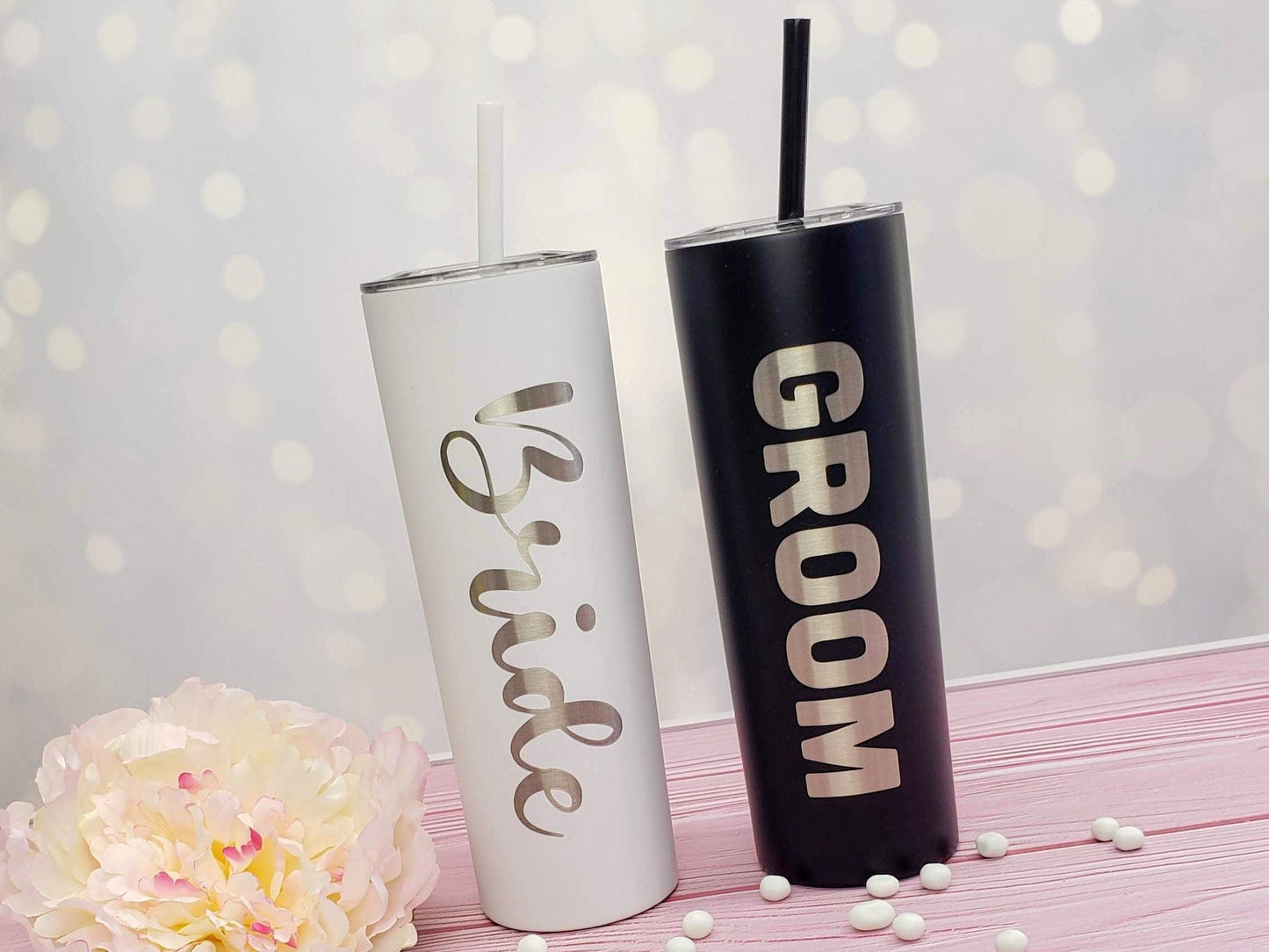 https://candywrapperstore.com/cdn/shop/products/bride-and-groom-laser-engraved-tumbler-with-your-choice-of-script-font-on-the-side-double-wall-20oz-hot-cold-tumbler-with-straw-engravedbridegroomtumbler-32364685230238.jpg?v=1691045612&width=1445